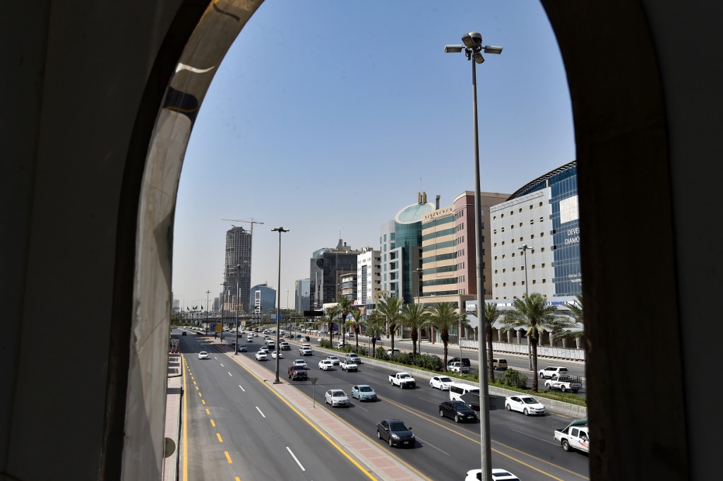 SAUDI ARABIA. Cars drive down King Fahad Road after authorities eased some of the lockdown measures that had been imposed in the Saudi capital Riyadh on June 21, 2020. Photo by Fayez Nureldine/AFP 