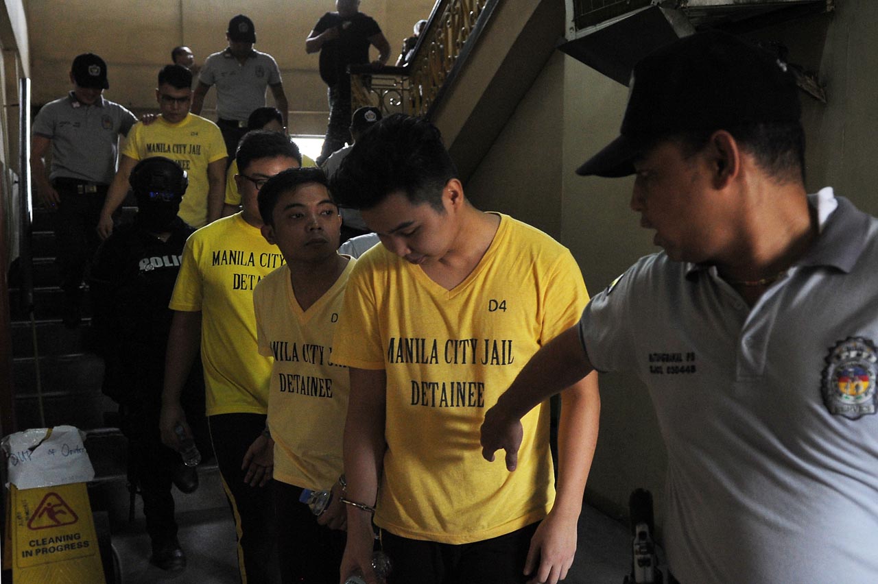 BAIL DENIED. Members of the Aegis Juris Fraternity are escorted by jail guards as they attend their arraignment in connection to the Atio Castillo hazing charges at the Manila RTC Branch 20 at the Manila City Hall on July 24, 2018. Photo by Ben Nabong 