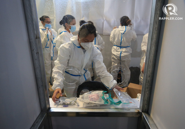 More evidence is needed. Philippine Coast Guard medical technologists prepare to screen potential COVID-19 patients at a newly installed cleaning facility in the Maynila Palace tent along Roxas Boulevard in Manila on May 5, 2020. Photo by Ben Nabong / Rappler 