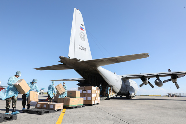 TEST KITS. Thousands of aid packages donated by China are unloaded at the Villamor Air Base in Pasay City on March 21, 2020. The donation includes assorted medical supplies, personal protective equipment, and testing kits for coronavirus. Palace photo 