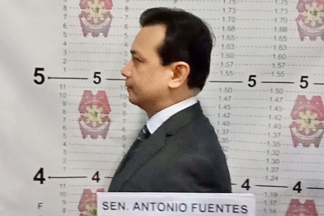 ARRESTED. Senator Antonio Trillanes IV undergoes booking procedures inside the Makati City Police Station. Photo by NCRPO 