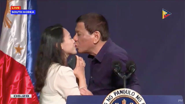 KISS ON THE LIPS. President Rodrigo Duterte kisses an overseas Filipino worker during his meeting with the Filipino community in South Korea on June 3, 2018. Screenshot from PTV video