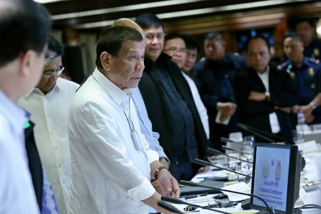 NO TO GERMS. The device around President Duterte's neck is described as an 'air purifier' to protect him from air-borne germs. Malacañang photo