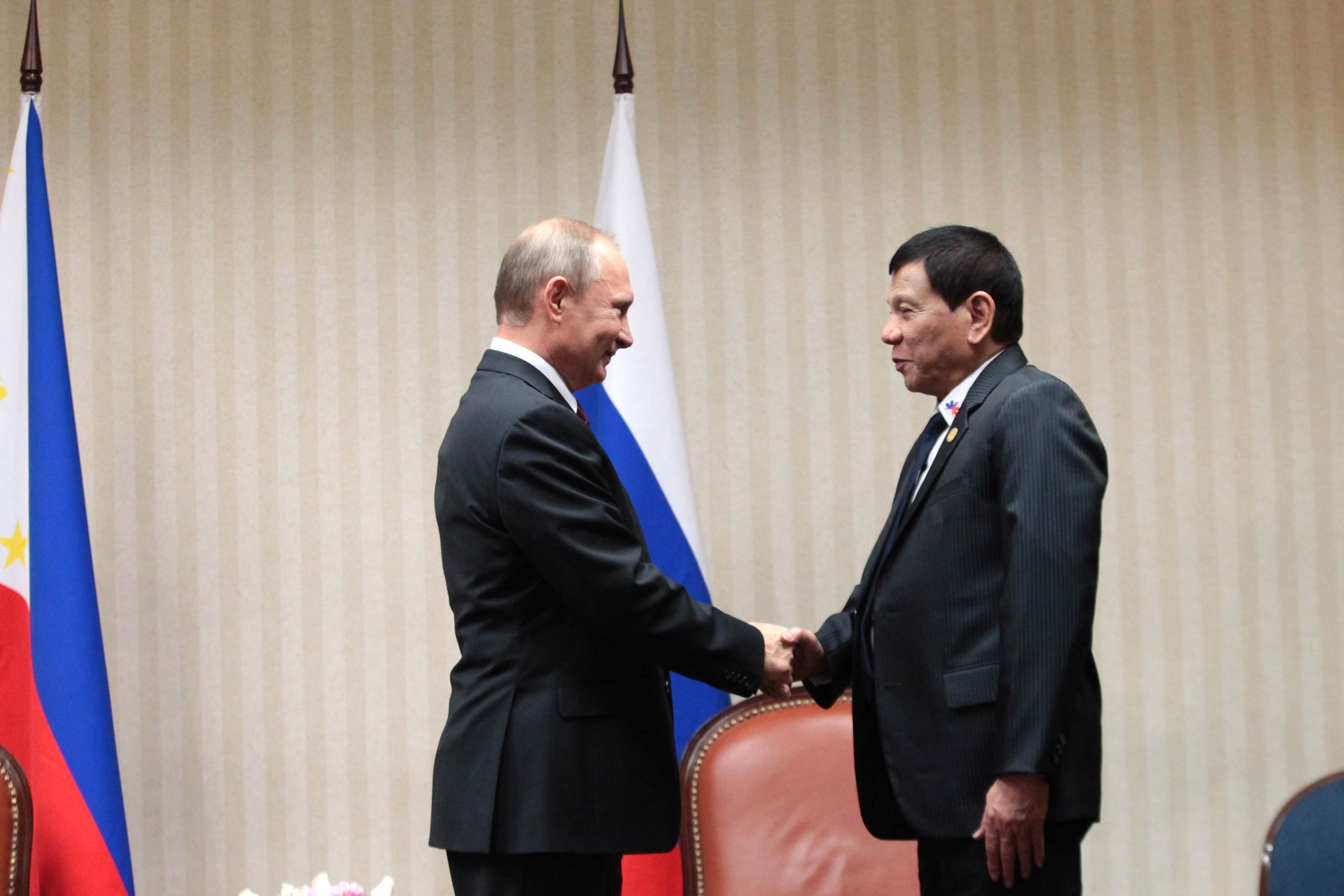 MEETING PUTIN. President Rodrigo Duterte and Russian President Vladimir Putin shake hands during their bilateral meeting at the sidelines of the Asia-Pacific Economic Cooperation (APEC) Leaders' Summit in Lima, Peru on November 19. File photo by Robinson Niñal Jr/Presidential Photo
