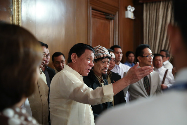 OUTLOOK FOR PEACE. President Rodrigo Duterte introduces MNLF chairman Nur Misuari to his Secretaries during a Cabinet meeting in Malacañang. Photo by King Rodriguez/Presidential photo  