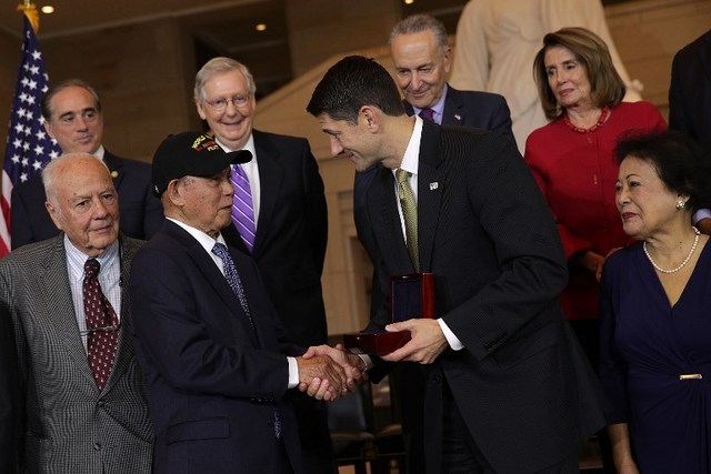 US RECOGNITION. US Speaker of the House Representative Paul Ryan shakes hands with Dean Delen, a Filipino veteran representing guerrilla units, as other officials look on during a Congressional Gold Medal presentation ceremony on October 25, 2017. Photo by Alex Wong/Getty Images/AFP  