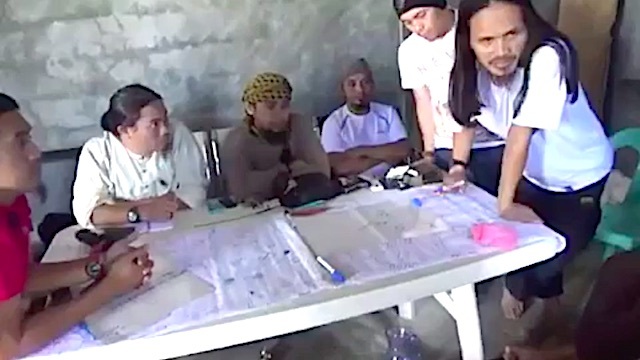PLANNING THE ATTACK. Screenshot of a video the military recovered from a Maute safe house shows the Maute brothers and Abu Sayyaf leader Isnilon Hapilon planning the attack in Marawi City
