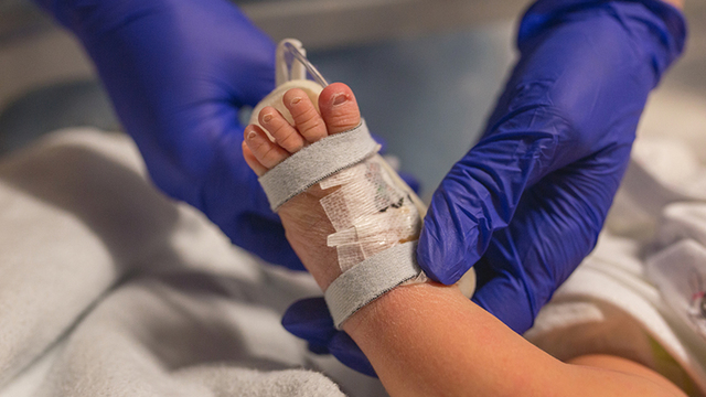 BABY CHECK. A doctor checks on a baby. Image from Shutterstock.com 