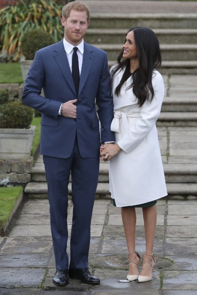 ENGAGED. Britain's Prince Harry and his fiancée US actress Meghan Markle pose for a photograph in the Sunken Garden at Kensington Palace in west London on November 27, 2017, following the announcement of their engagement.  Photo Daniel Leal-Olivas/AFP 