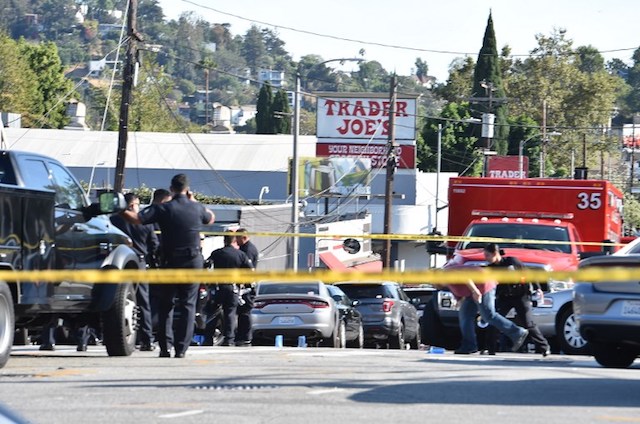 One dead, suspect surrenders after U.S. supermarket hostage drama