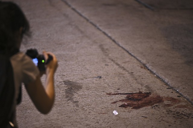 ATTACKS. Blood is seen on a street as a video journalist is filming, where Jimmy Sham, convener of the Civil Human Rights Front (CHRF), was assaulted by people wielding hammers in the Mongkok district of Kowloon in Hong Kong on October 16, 2019. Photo by Philip Fong/AFP 