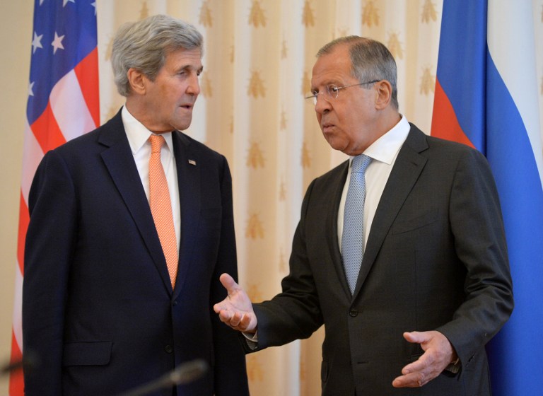 In this file photo, Russian Foreign Minister Sergey Lavrov (R) speaks with US Secretary of State John Kerry during their meeting in Moscow, on July 15, 2016. Natalia Kolesnikova/AFP 