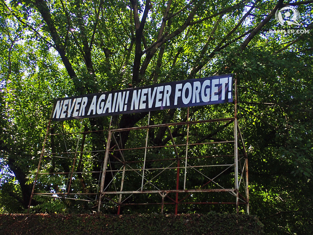 PROTEST. These words are visible among the trees as you walk deeper into Bantayog's compound.