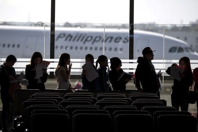 GOING HOME. In this file photo, Filipina workers returning home from Kuwait arrive at the Manila International Airport on February 18, 2018. File photo by Noel Celis/AFP 