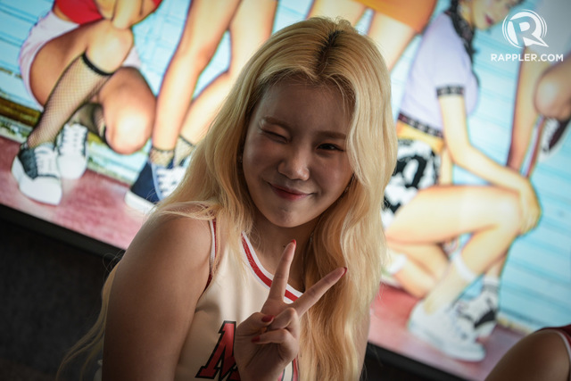 BUBBLY. JooE playfully winks at the camera.  