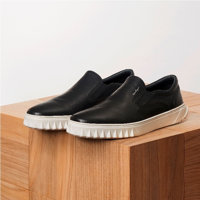 black canvas slip on sneakers