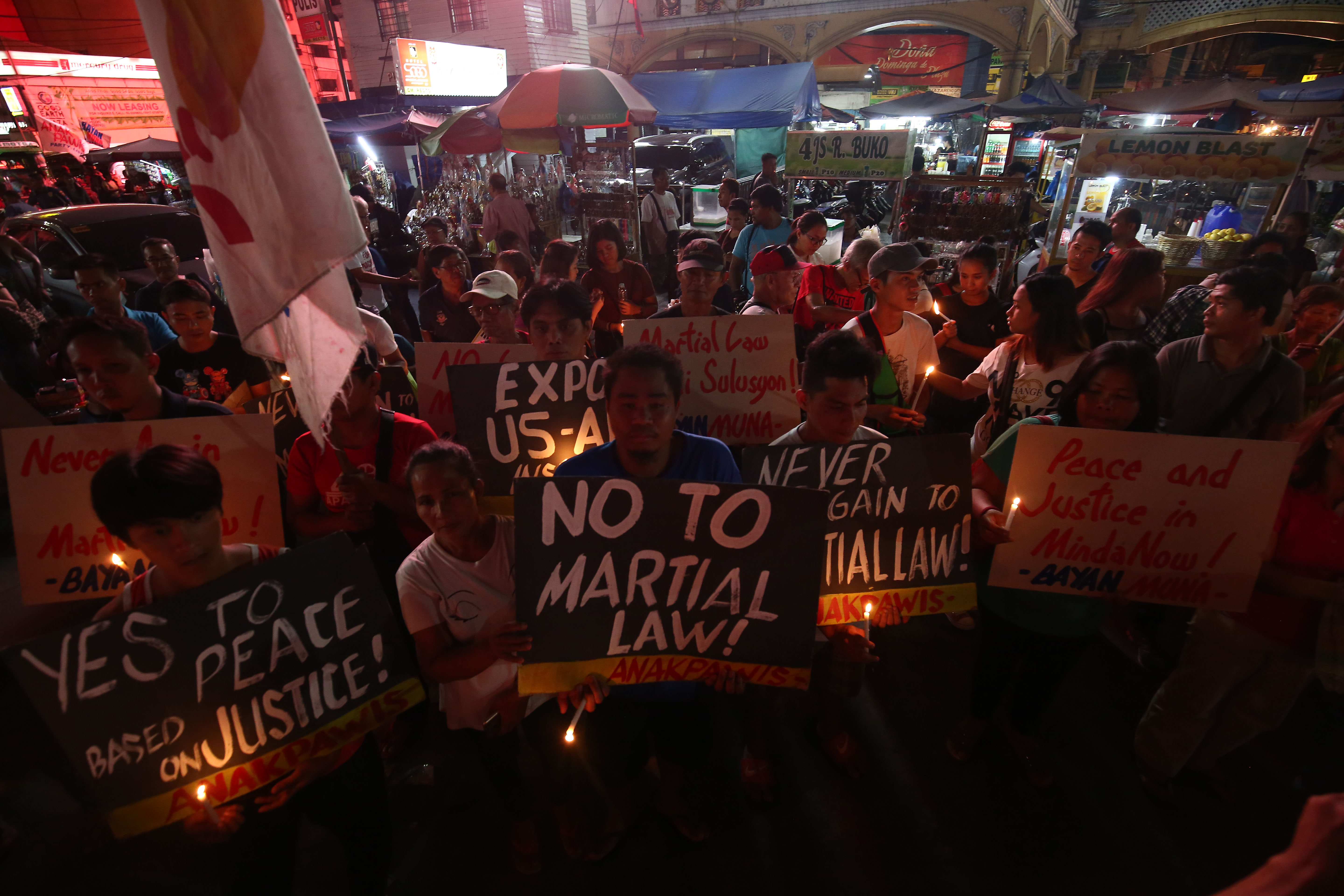 IN PHOTOS Advocates light candles rejecting martial law