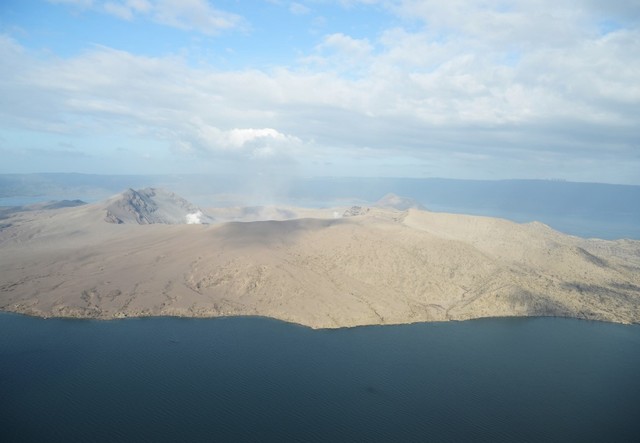 TAAL VOLCANO. White steam is emitted from Taal Volcano as seen from a Philippine Air Force helicopter during an aerial survey on January 21, 2020. File photo by Ted Aljibe/AFP 